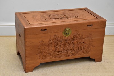 Lot 1056 - A Chinese carved camphorwood blanket box,...