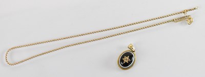 Lot 1250 - An antique yellow metal black stone and...