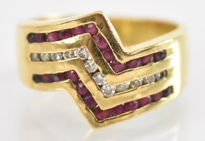 Lot 1257 - An 18ct yellow gold ruby and diamond set ring,...