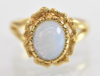 Lot 1268 - An 18ct yellow gold opal set ring, size N,...