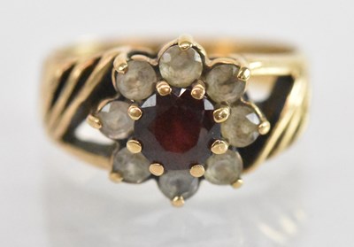 Lot 1352 - A 9ct yellow gold red and white stone set ring,...