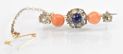 Lot 1360 - A yellow metal coral, white and blue stone set...