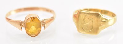 Lot 1355 - A yellow metal citrine set ring, the central...