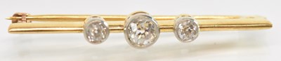 Lot 750 - A yellow metal diamond set bar brooch, the...