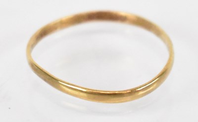 Lot 1391 - A 22ct yellow gold wedding band, size L/M,...