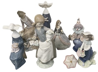 Lot 615 - LLADRÓ; a group of seven porcelain figures...