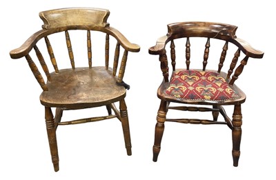 Lot 36 - Two smokers' bow back elbow chairs, one with...