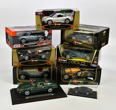 Lot 300 - A collection of diecast cars to include Aston...