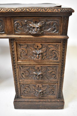 Lot 22 - An early 20th century carved oak nine-drawer...