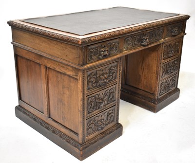 Lot 22 - An early 20th century carved oak nine-drawer...