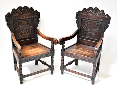 Lot 70 - A pair of 19th century oak wainscot chairs...