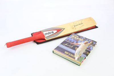 Lot 1127 - SHANE WARNE; an autographed child's Mitre...