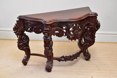 Lot 1059 - A reproduction carved serpentine fronted...