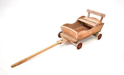 Lot 630 - A vintage pine pull-along go cart, 74 x 35cm.