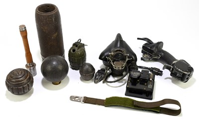 Lot 449 - Four inert grenade shells, with a cast iron...