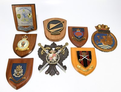 Lot 451 - A collection of eight military plaques...