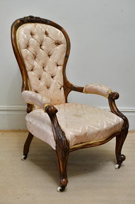 Lot 1215 - A Victorian walnut spoon back open armchair,...