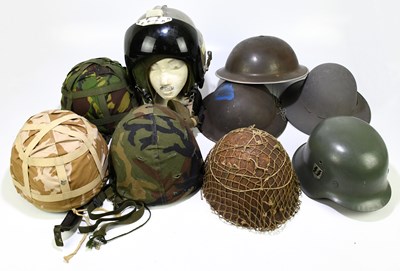 Lot 435 - A reproduction German WWII helmet with three...