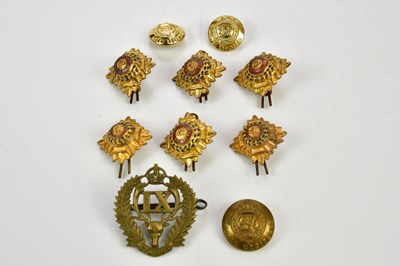 Lot 1306 - A small group of military badges and buttons.