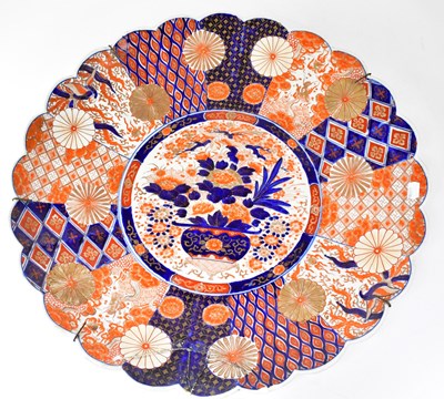 Lot 168 - A large Imari charger with scalloped edge,...