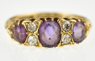 Lot 1008 - An 18ct gold ring set with three graduated...