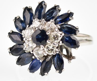 Lot 1031 - A white gold ring, the central claw set...