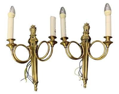 Lot 95 - A pair of brass two branch wall lights with...