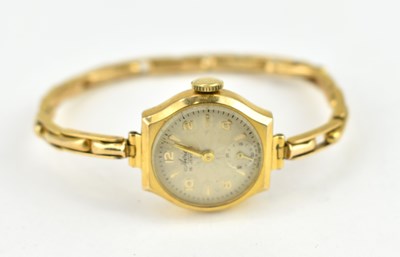 Lot 1185 - AVIA; a ladies' 9ct gold wristwatch, the star...