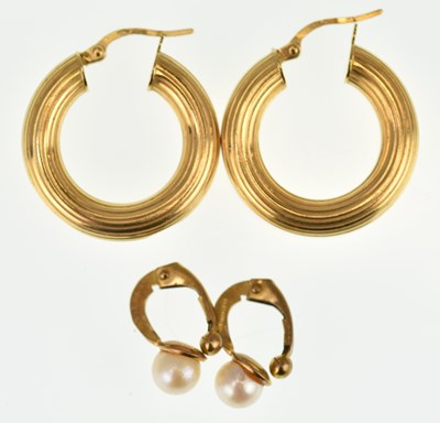 Lot 1104 - Two pairs of 9ct gold earrings comprising a...