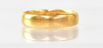 Lot 986 - A 22ct gold wedding band, size M, approx. 3.8g.