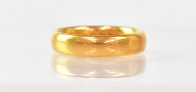 Lot 984 - A 22ct gold wedding band, approx. 6.6g.