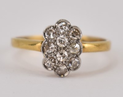 Lot 1001 - An 18ct gold diamond set floral cluster ring,...