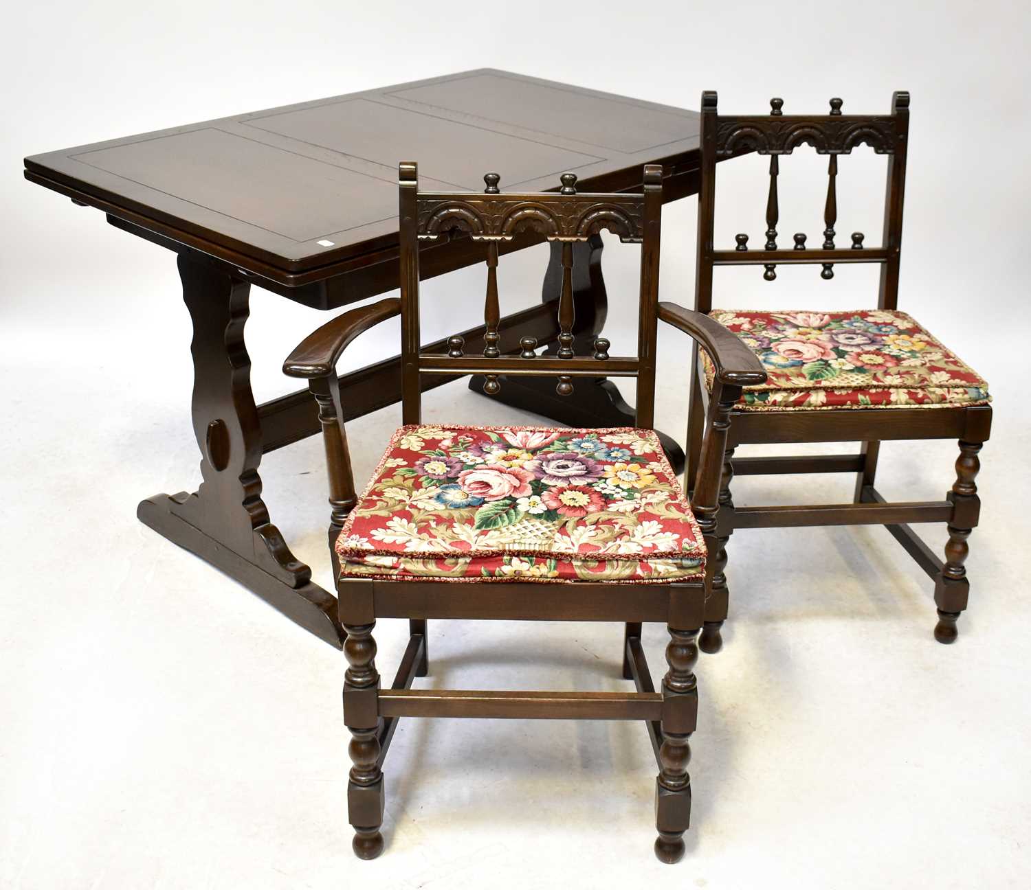 Lot 8 - ERCOL; a dark stained dining suite comprising...