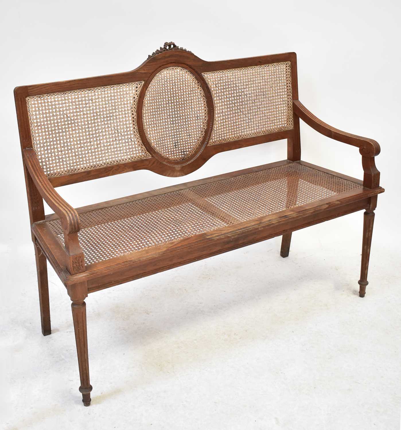 Lot 32 - An early 20th century bergère caned two-seater...
