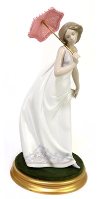 Lot 529 - LLADRO; a ceramic figure of a girl with...