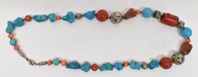 Lot 1342 - An Islamic white metal, turquoise and coral...