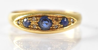 Lot 1010 - An 18ct yellow gold diamond and sapphire ring,...