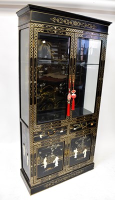 Lot 8 - A contemporary black lacquered cabinet with...