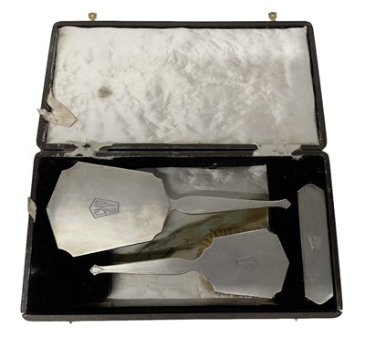 Lot 1147 - A hallmarked silver cased three piece Art Deco...