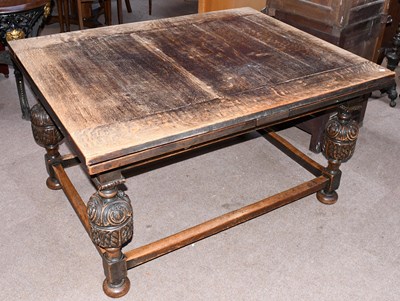 Lot 2759 - A 1920s carved oak extending dining table,...