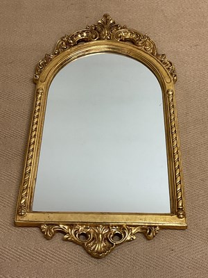 Lot 756 - A Baroque style gilded wall mirror, 93 x 48cm.