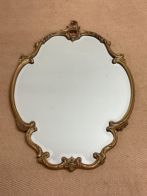 Lot 757 - A Baroque style gilded wall mirror, 89 x 57cm.