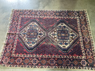 Lot 698 - A Persian rug with two central medallions, 205...