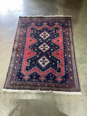 Lot 697 - A Mazlaghan Persian rug with a bold geometric...