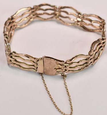 Lot 602 - A 9ct yellow gold four bar gate link bracelet,...