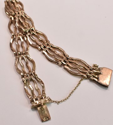 Lot 602 - A 9ct yellow gold four bar gate link bracelet,...