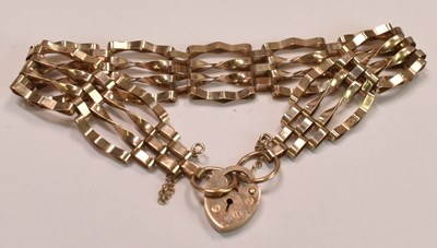 Lot 615 - A 9ct yellow gold four bar gate link bracelet...