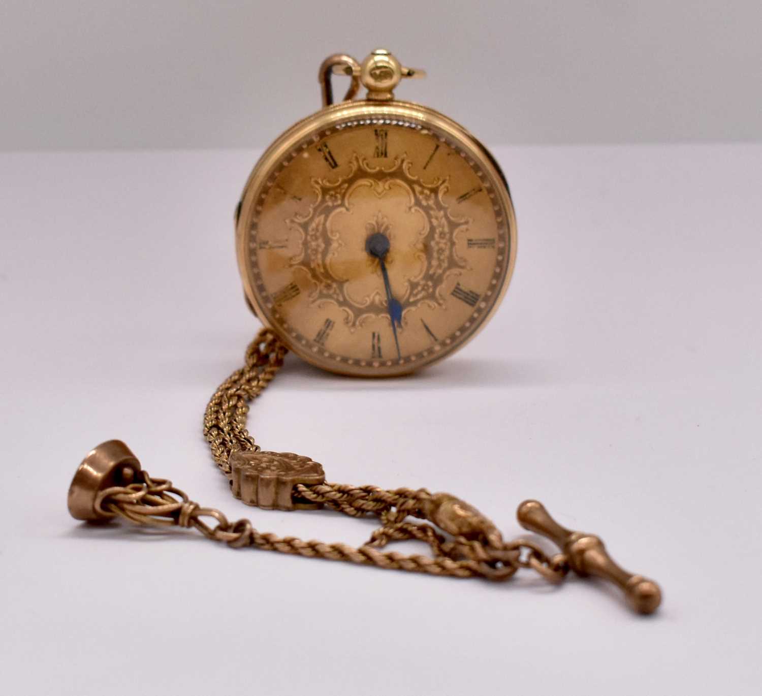 Lot 647 - An 18ct yellow gold open face fob watch,