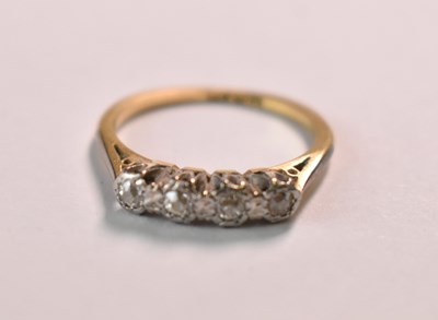 Lot 618 - An 18ct yellow gold four stone diamond set...