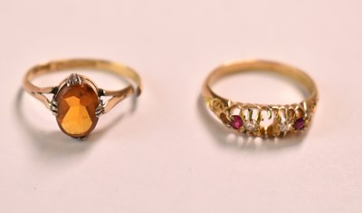 Lot 595 - An 18ct yellow gold ruby and diamond ring,...